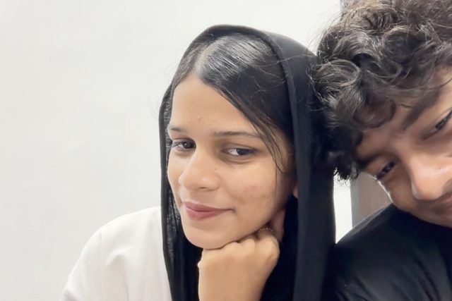 A close-up selfie with a chin resting on a hand.