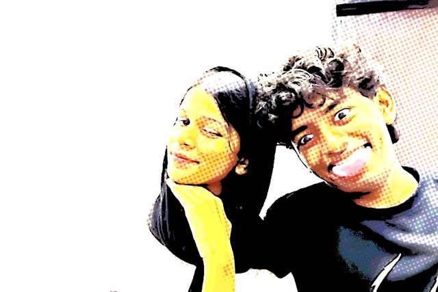 A playful, colour-filtered photo-booth selfie.