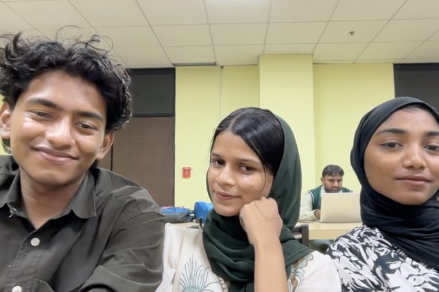 A candid group selfie with a playful expression.