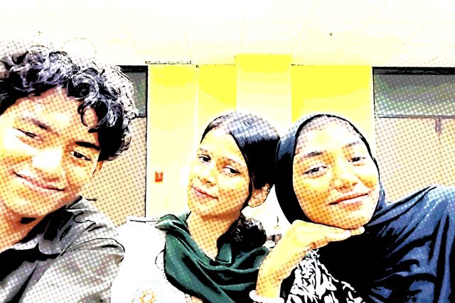 A bright, colour-filtered group selfie.