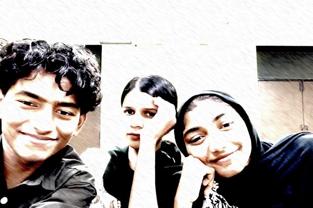 A playful high-contrast group selfie.